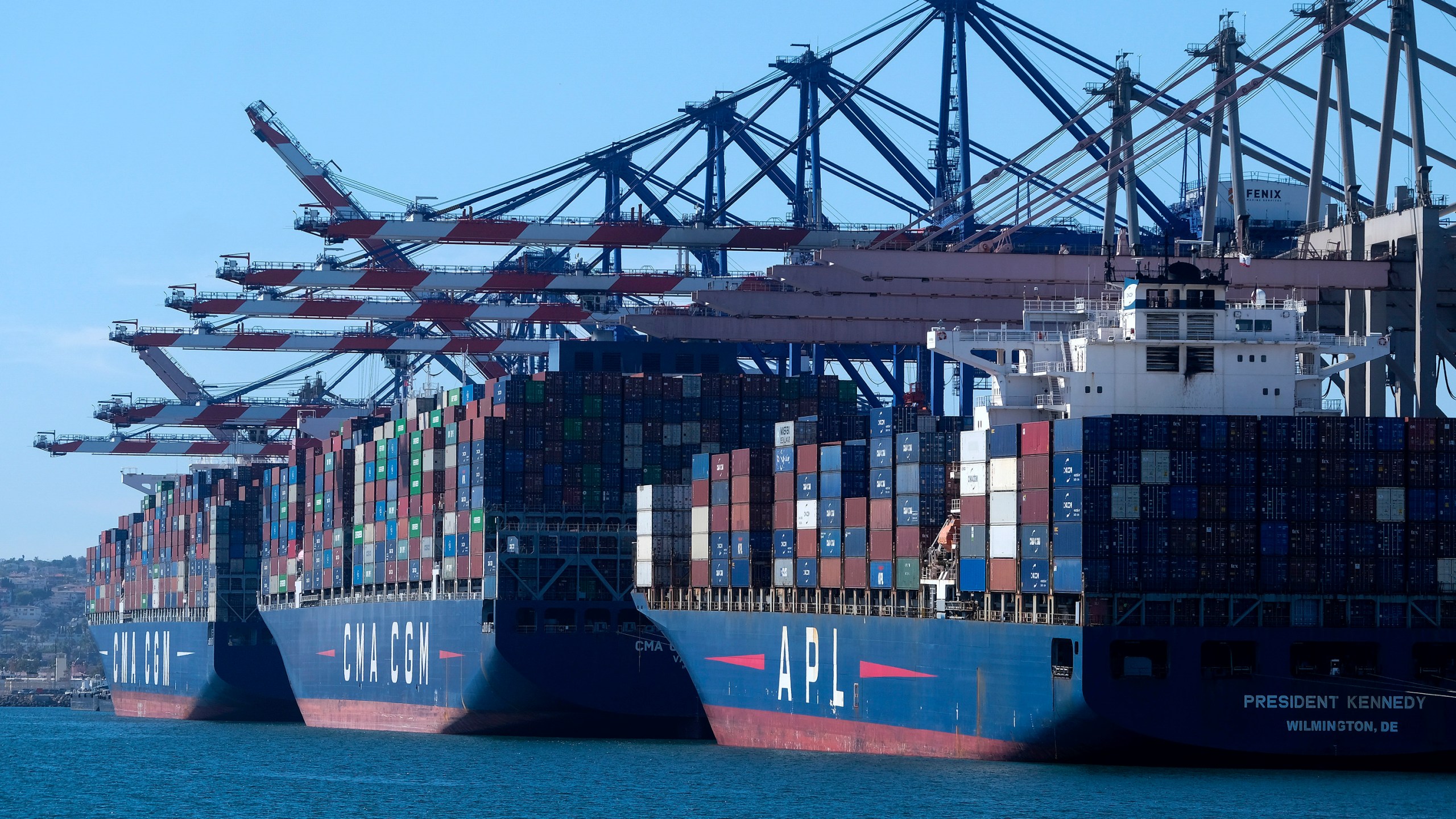 Cargo containers sit stacked on ships at the Port of Los Angeles, Wednesday, Oct. 20, 2021 in San Pedro, Calif. (AP Photo/Ringo H.W. Chiu, File)