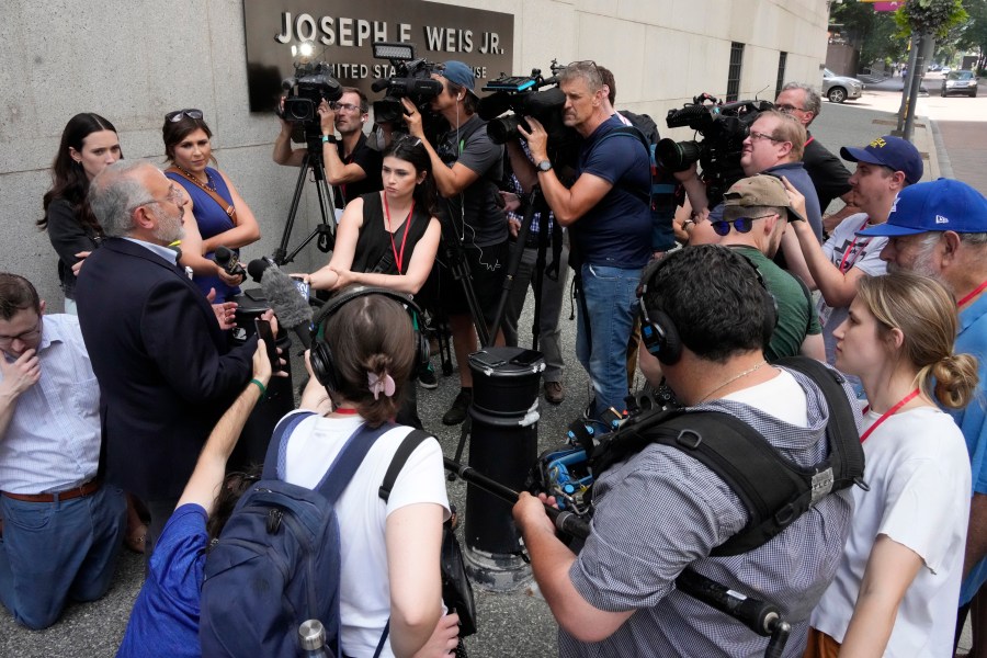 Jeffrey Finkelstein, CEO of the Jewish Federation of Pittsburgh, second from left, is surrounded by media outside the Joseph F. Weis Jr. United States Courthouse in Pittsburgh after a federal jury announced they had found Robert Bowers, who in 2018 killed 11 people at the Tree of Life synagogue in Pittsburgh, eligible for the death penalty on Thursday, July 13, 2023. (AP Photo/Gene J. Puskar)