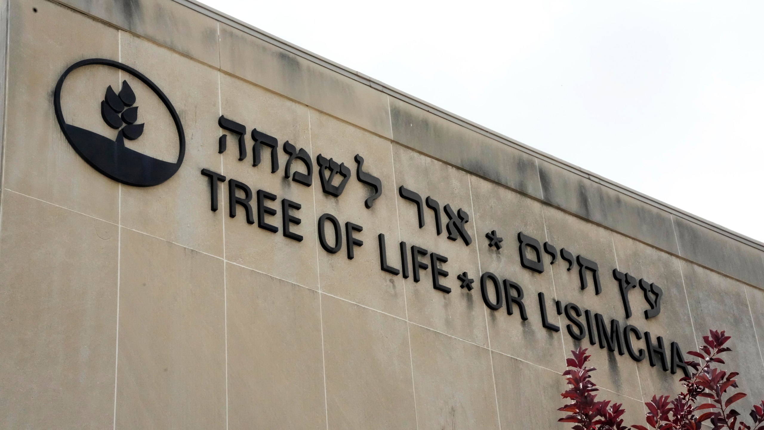 Signage marks the exterior of the dormant landmark Tree of Life synagogue in Pittsburgh's Squirrel Hill neighborhood on Thursday, July 13, 2023, the day a federal jury announced they had found Robert Bowers, who in 2018 killed 11 people at the synagogue, eligible for the death penalty. (AP Photo/Gene J. Puskar)