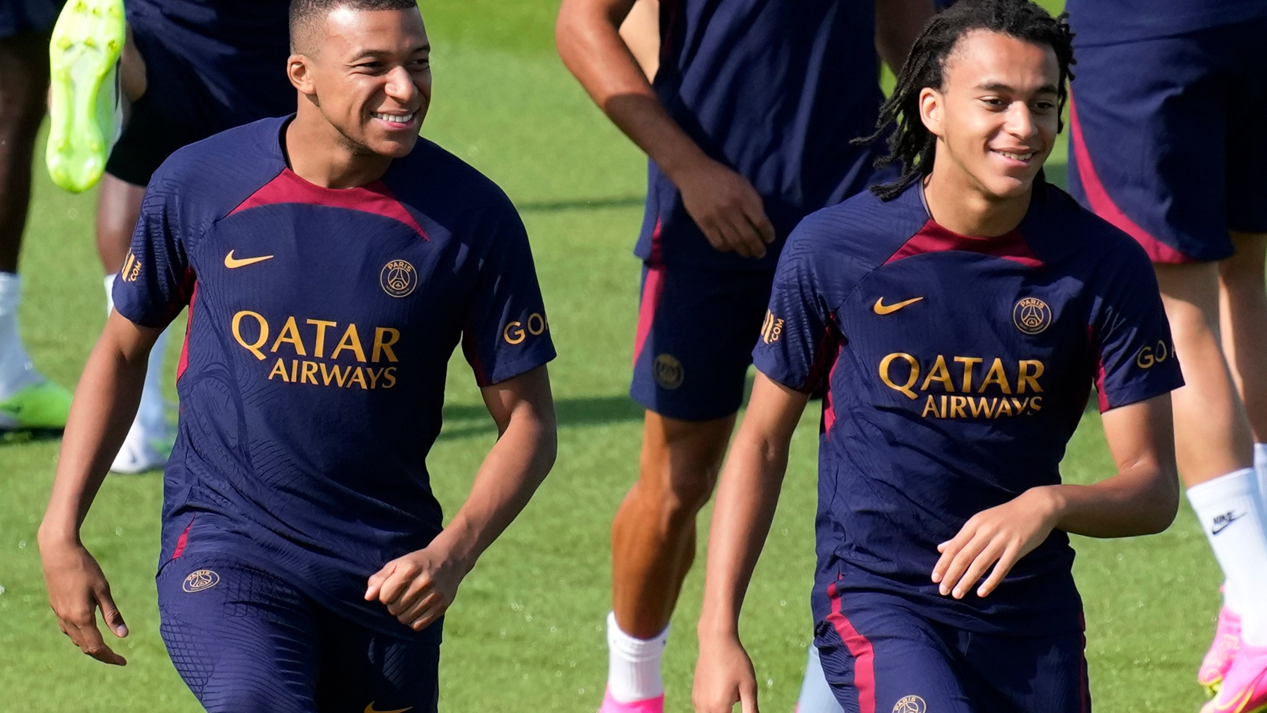 Kylian Mbappe, left, and his brother Ethan Mbappe attend a training session at the new Paris Saint-Germain training center Thursday, July 20, 2023 in Poissy, west of Paris. (AP Photo/Christophe Ena)