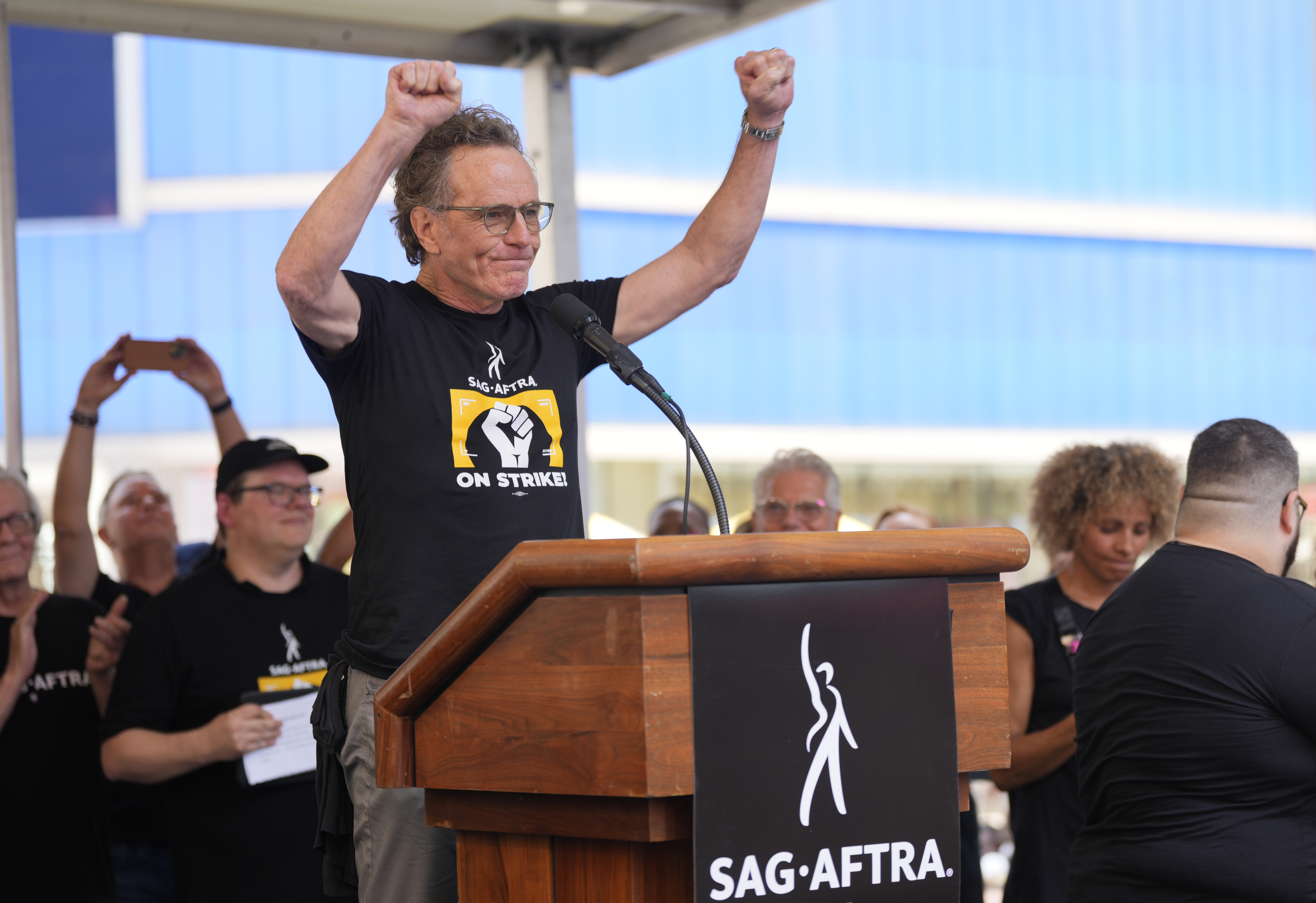 Actor Bryan Cranston speaks during the SAG-AFTRA "Rock the City for a Fair Contract" rally in Times Square on Tuesday, July 25, 2023, in New York. Charles Sykes/Invision/AP)