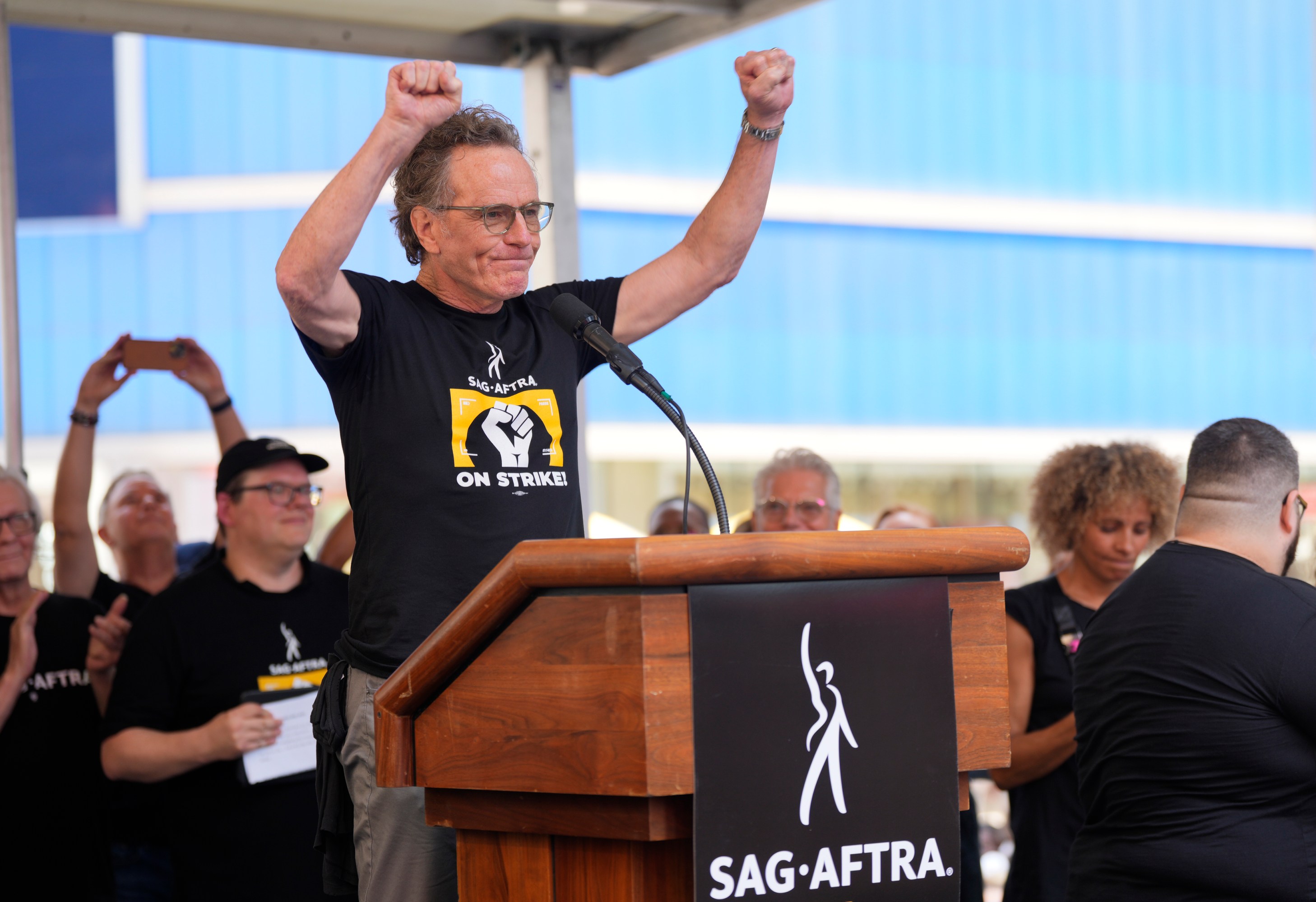 Actor Bryan Cranston speaks during the SAG-AFTRA "Rock the City for a Fair Contract" rally in Times Square on Tuesday, July 25, 2023, in New York. Charles Sykes/Invision/AP)