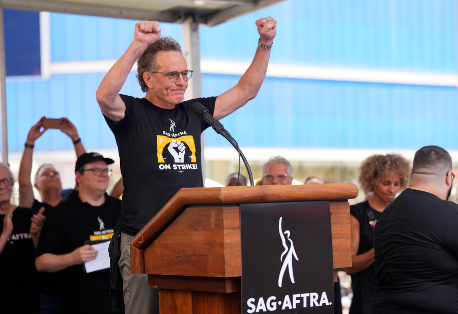 Actor Bryan Cranston speaks during the SAG-AFTRA "Rock the City for a Fair Contract" rally in Times Square on Tuesday, July 25, 2023, in New York. The actors strike comes more than two months after screenwriters began striking in their bid to get better pay and working conditions. (Photo by Charles Sykes/Invision/AP)