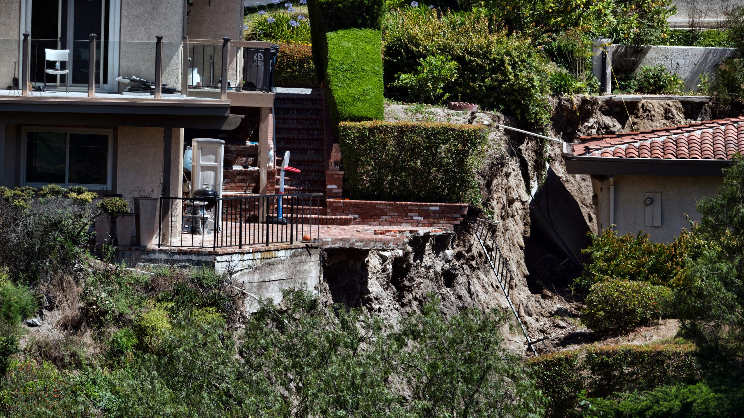 A partially destroyed patio caused by earth movement is seen in Southern California's Palos Verdes Peninsula's Rolling Hills Estates on July 10, 2023. (Richard Vogel/Associated Press)