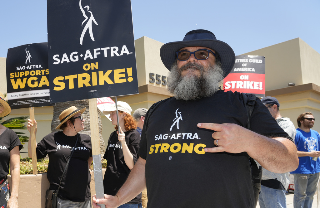 Jack Black walks on a picket line outside Paramount studios on Monday, July 24, 2023, in Los Angeles. The actors strike comes more than two months after screenwriters began striking in their bid to get better pay and working conditions. (AP Photo/Chris Pizzello)