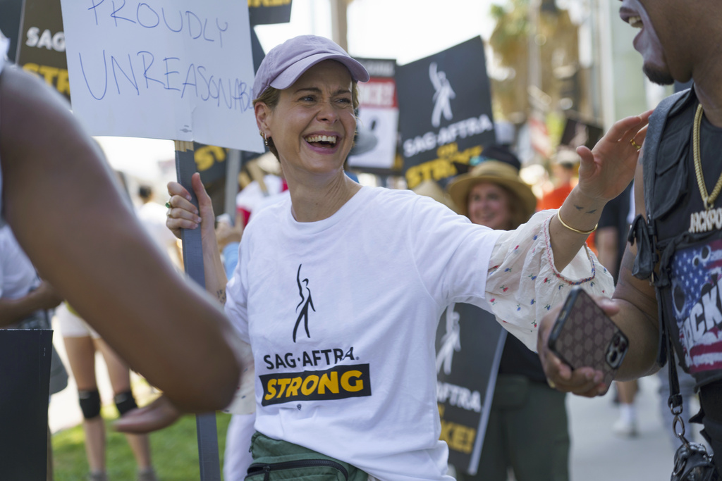 Actor Sarah Paulson joins a picket line outside Netflix studios on Tuesday, July 25, 2023, in Los Angeles. The actors strike comes more than two months after screenwriters began striking in their bid to get better pay and working conditions. (AP Photo/Mya Vinnett)