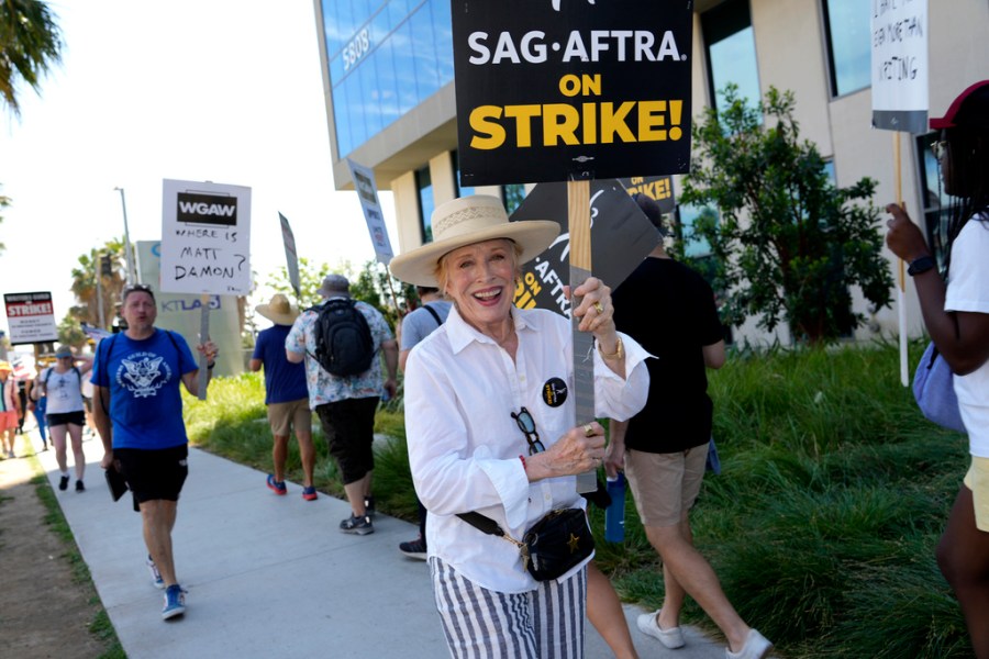 Actor Holland Taylor walks on a picket line outside Netflix studios on Wednesday, July 26, 2023, in Los Angeles. The actors strike comes more than two months after screenwriters began striking in their bid to get better pay and working conditions. (AP Photo/Chris Pizzello)