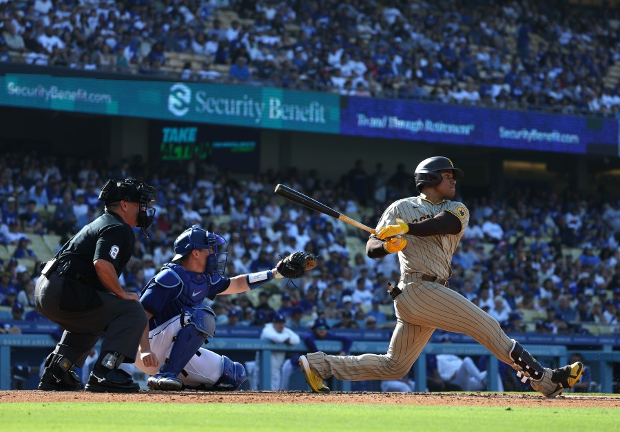 Juan Soto #22 of the San Diego Padres at bat in front of Will Smith #16 of the Los Angeles Dodgers during a 4-2 loss to the Los Angeles Dodgers at Dodger Stadium on May 13, 2023. (Harry How/Getty Images)