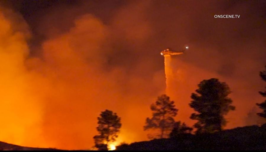 Firefighters work to extinguish the “Dry Fire,” as the flames continued spreading toward Castaic Lake on July 11, 2023.