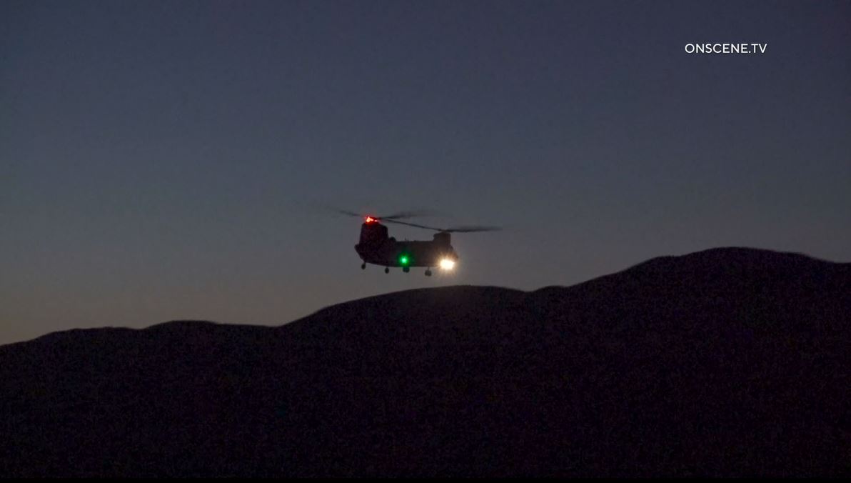 Firefighters work to extinguish the “Dry Fire,” as the flames continued spreading toward Castaic Lake on July 11, 2023. (OnScene.TV)