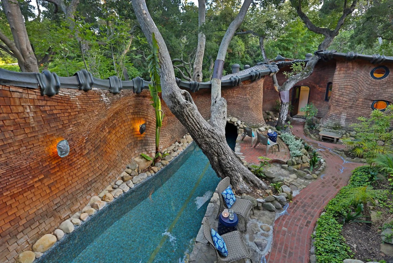 The interior courtyard features an outdoor shower, room to entertain and the pool, which leads to the grotto. (Sotheby's International Realty)