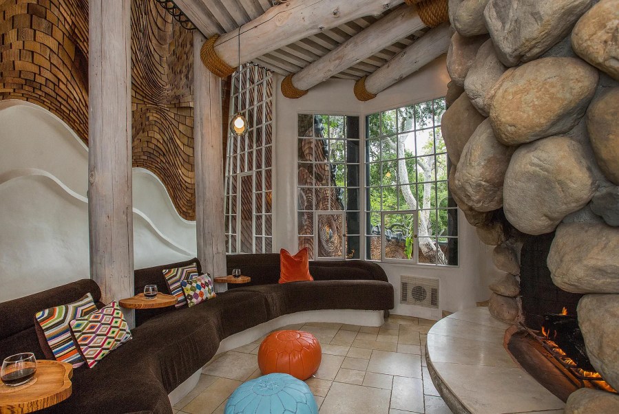 The interior of the "Whale House" in Santa Barbara features panoramic views, rock features and wood panels. (Sotheby's International Realty)