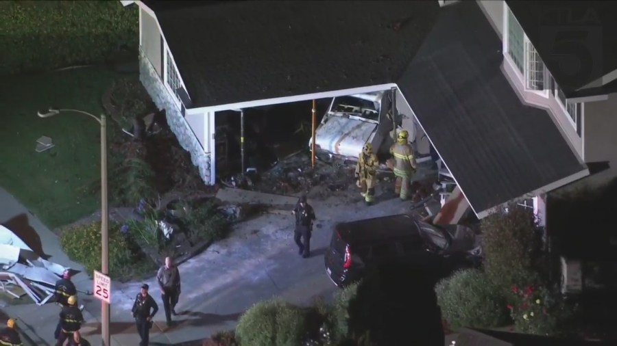 One person was hospitalized after a vehicle slammed into a Seal Beach home on July 7, 2023. (KTLA)