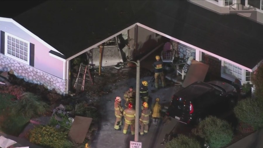 One person was hospitalized after a vehicle slammed into a Seal Beach home on July 7, 2023. (KTLA)