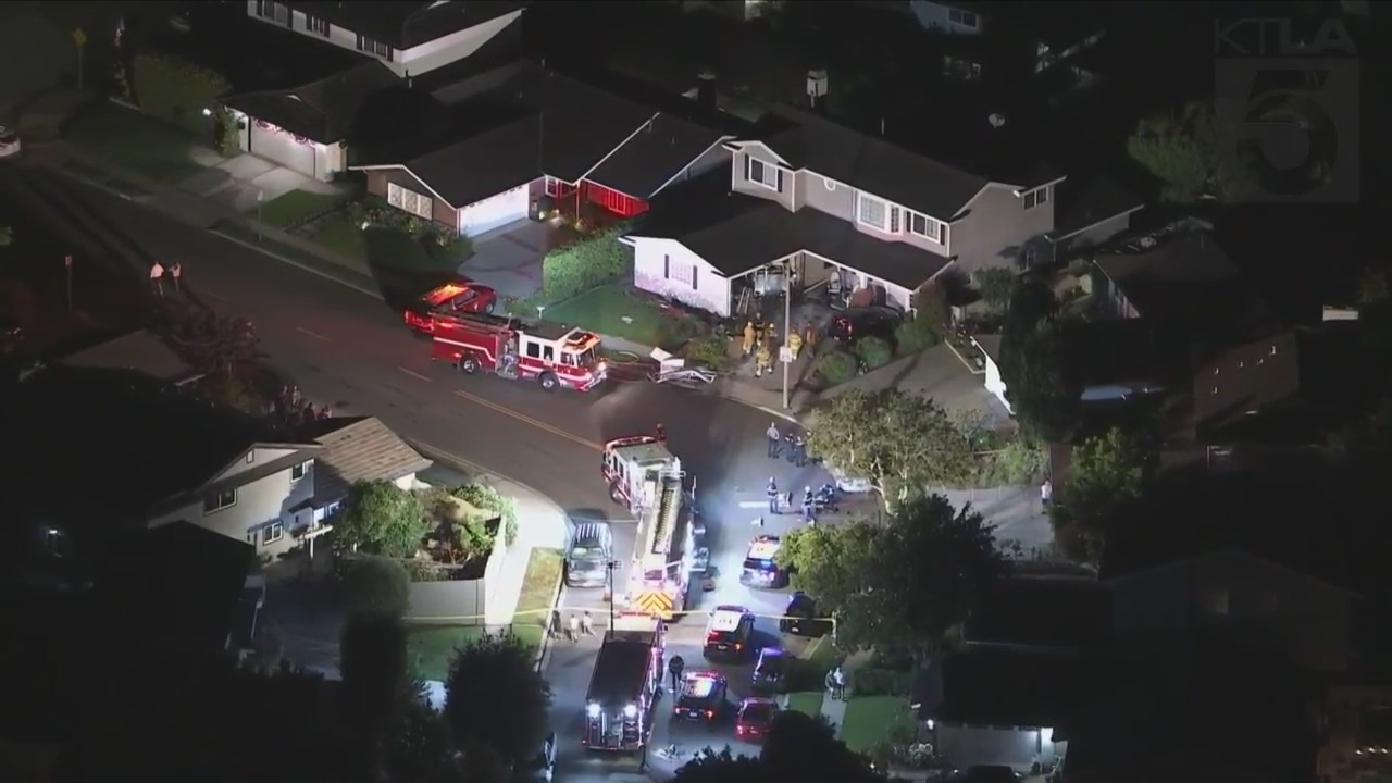 One person was hospitalized after a vehicle slammed into a Seal Beach home on July 7, 2023. (KTLA)