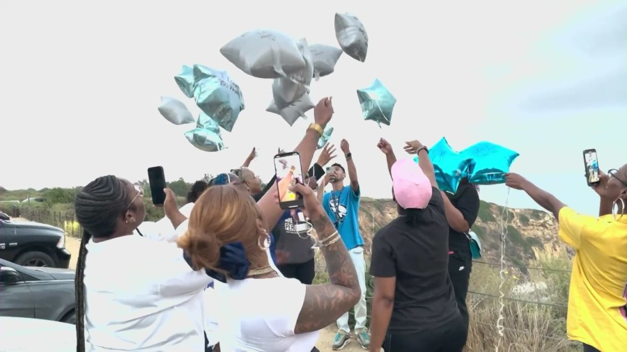 Family and friends held a vigil to remember a man and a woman who were murdered on July 24 in Rancho Palos Verdes. (Source: KTLA)