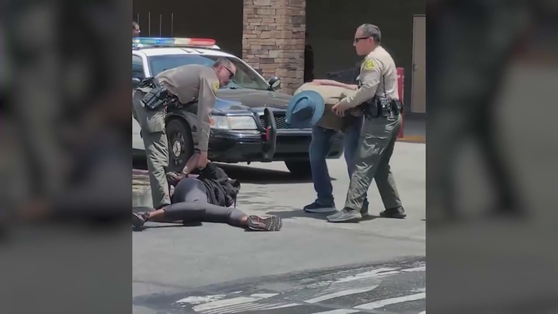 Video shows an LASD deputy slamming a woman to the ground outside a WinCo grocery store in Lancaster on June 24, 2023. (KTLA)