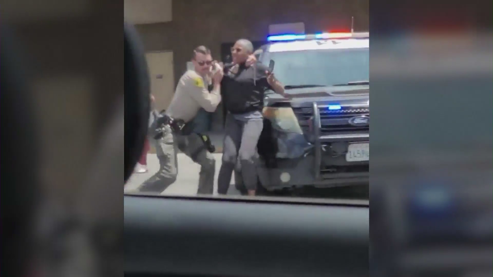 Video shows an LASD deputy slamming a woman to the ground outside a WinCo grocery store in Lancaster on June 24, 2023. (KTLA)