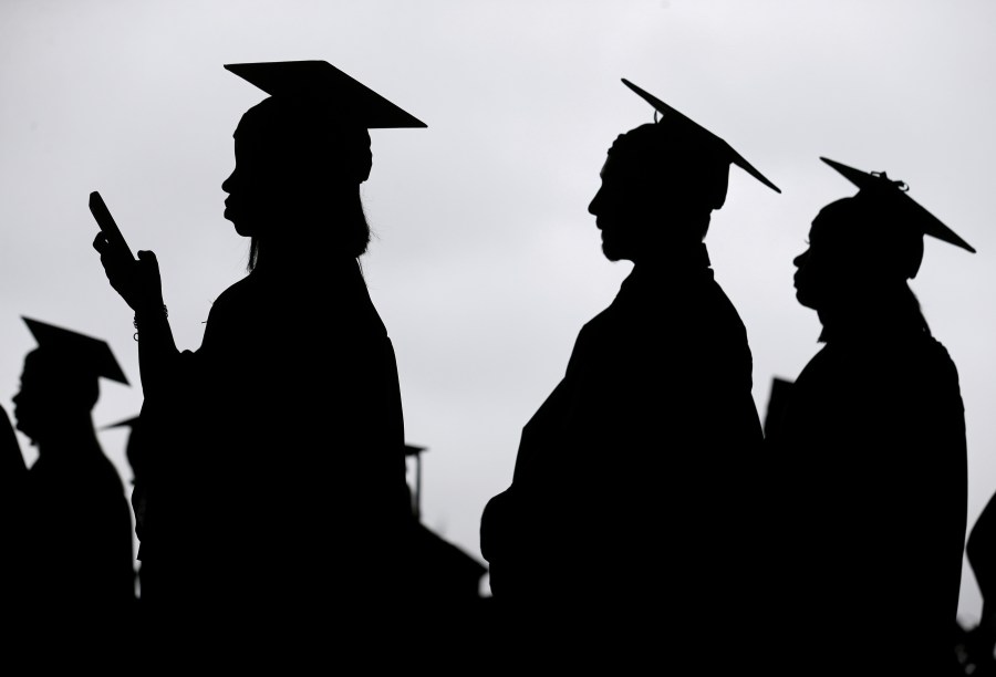 New graduates line up before the start of a community college commencement in East Rutherford, N.J. on May 17, 2018. (Seth Wenig/Associated Press)