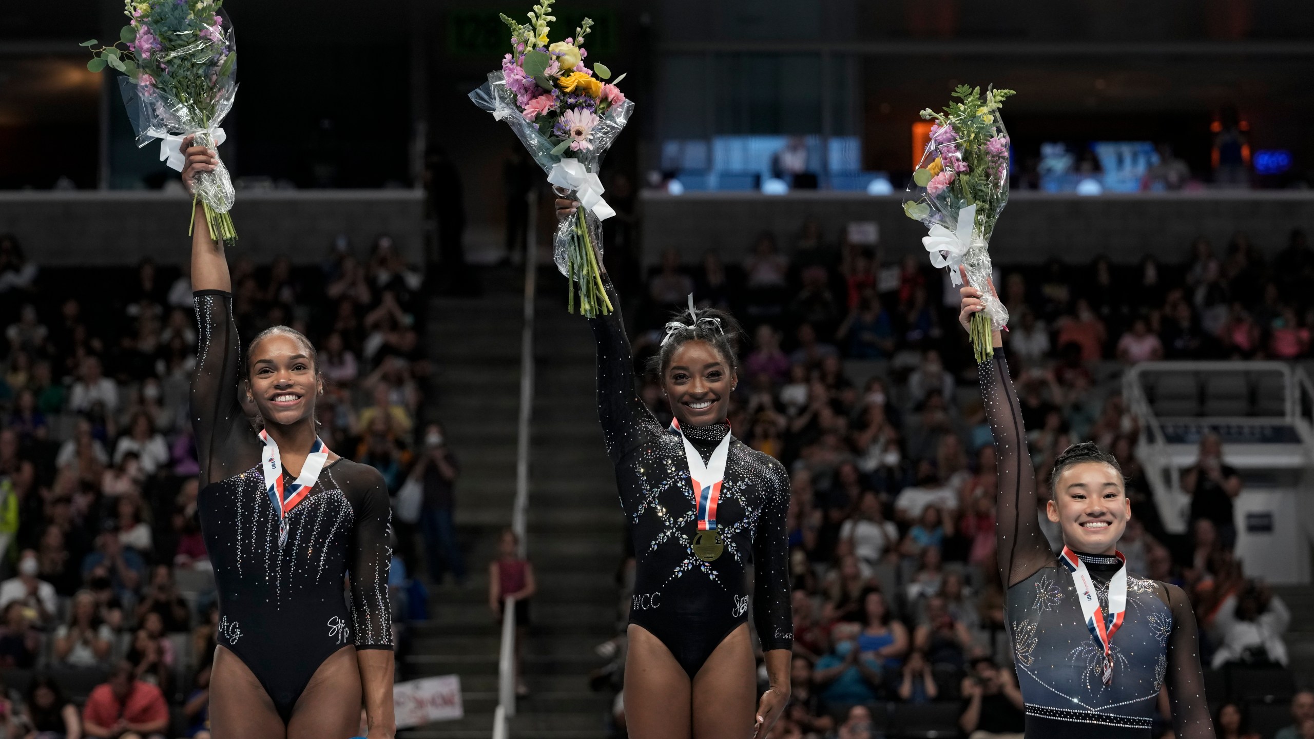 Frome left, Shilese Jones, Simone Biles and Leanne Wong pose for a photograph after placing second, first and third place, respectively, in all-around competition at the U.S. Gymnastics Championships, Sunday, Aug. 27, 2023, in San Jose, Calif. (AP Photo/Godofredo A. Vásquez)