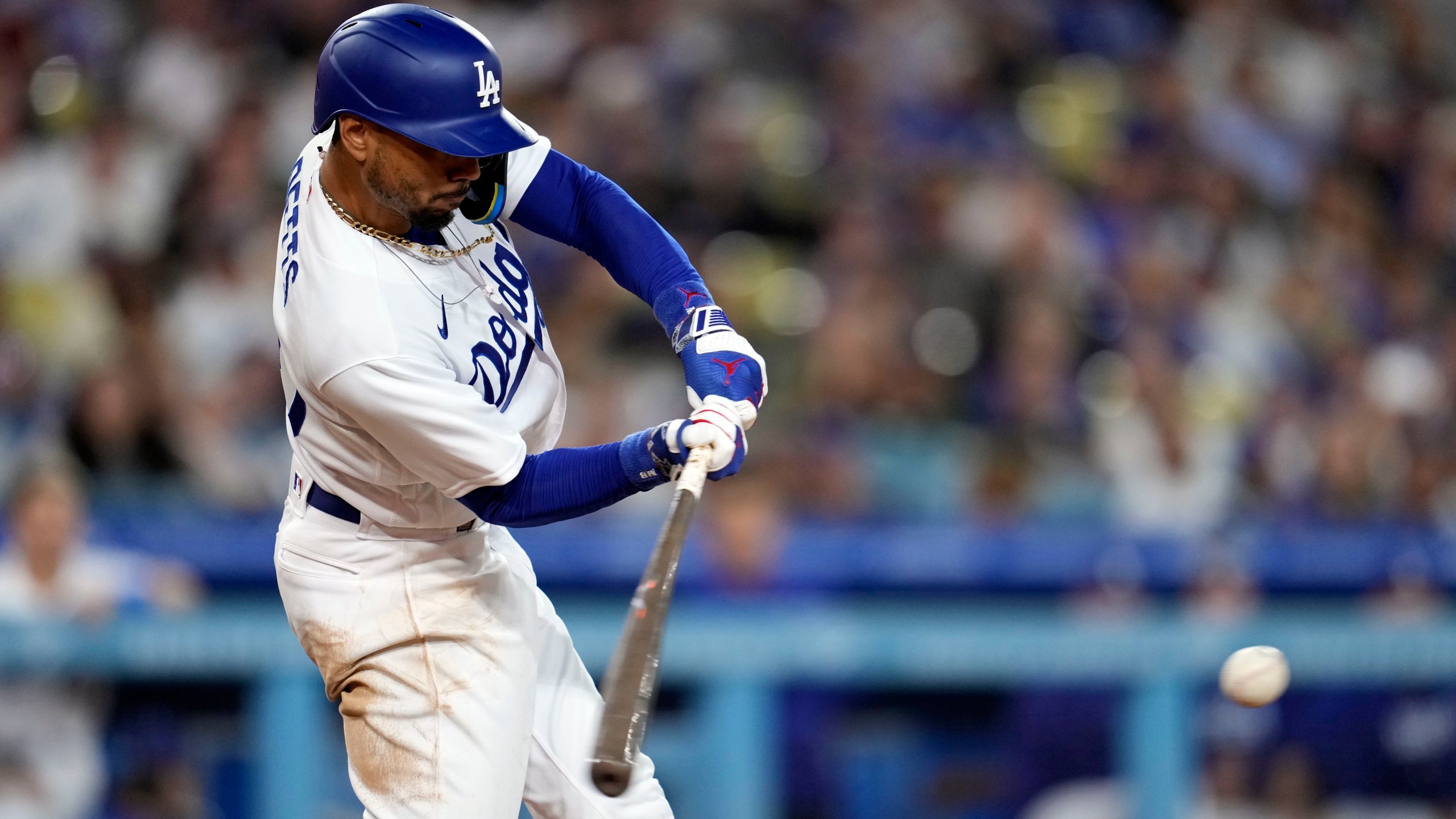 Mookie Betts #50 of the Los Angeles Dodgers singles in the eighth inning against the Colorado Rockies at Dodger Stadium on Aug. 10, 2023 in Los Angeles. (Kevork Djansezian/G