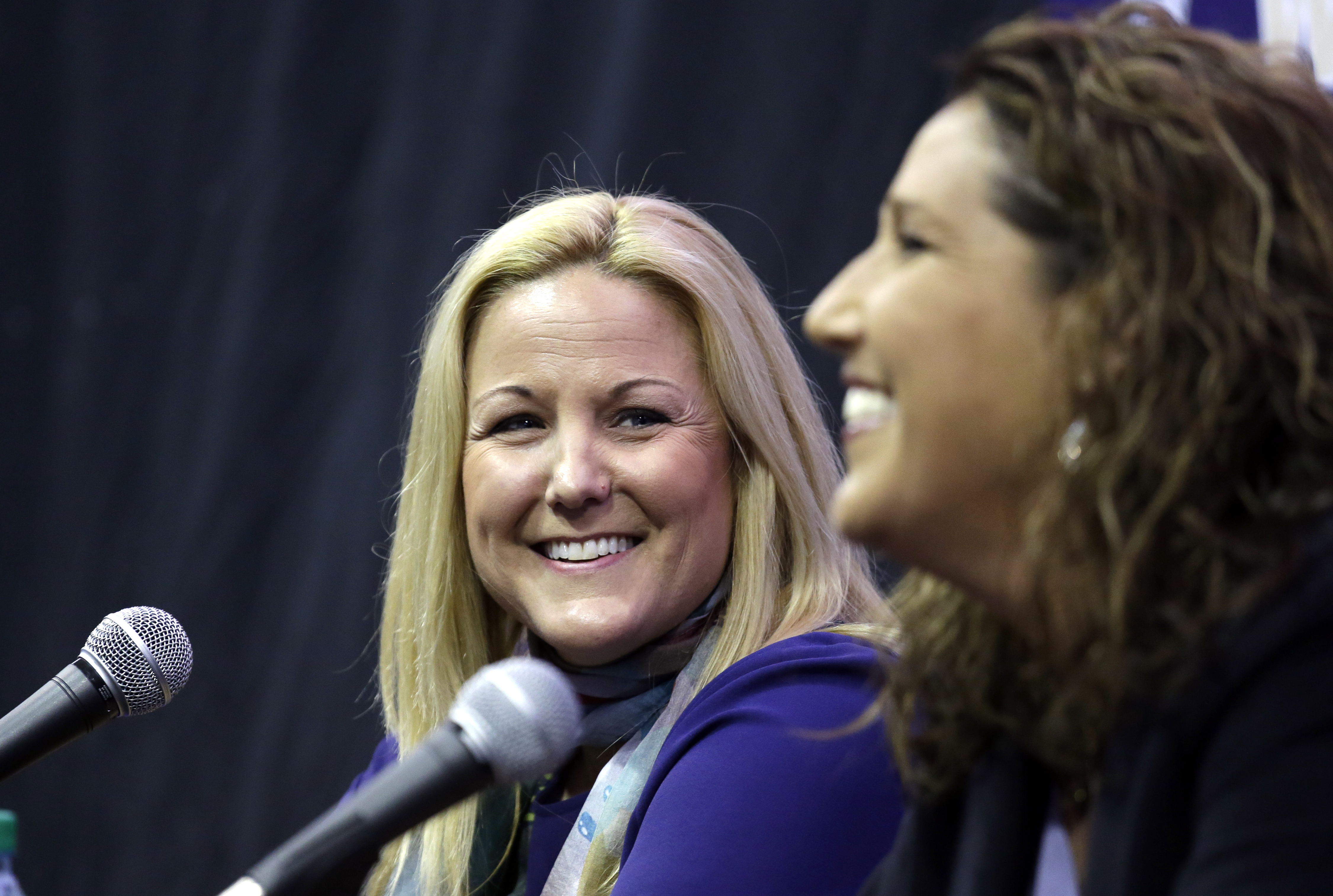 Washington Athletic Director Jennifer Cohen, left, looks on as new Washington women's basketball head coach Jody Wynn speaks at the end of a news conference introducing her Monday, April 17, 2017, in Seattle. (AP Photo/Elaine Thompson)