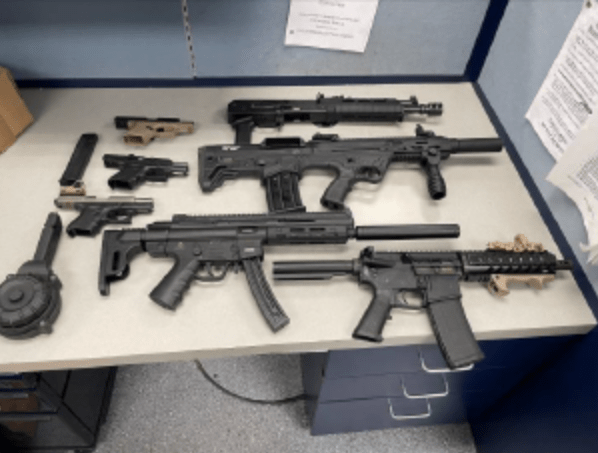 The LAPD on Aug. 24, 2023, released this photo of guns they say were seized from the home of rapper Polo G, another residence and the rapper's vehicle.