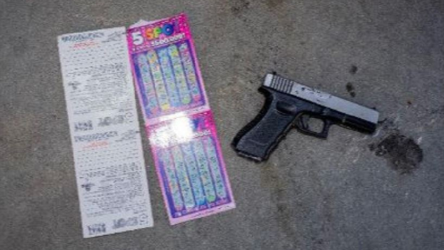 Weapon and stolen lottery tickets discovered at an armed robbery suspect's residence on on July 26, 2023. (El Segundo Police Department)