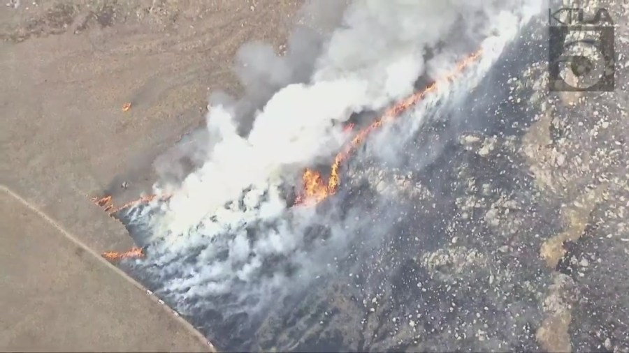 Fire crews battling the massive Rock Fire in Perris on August 9, 2023. (KTLA)