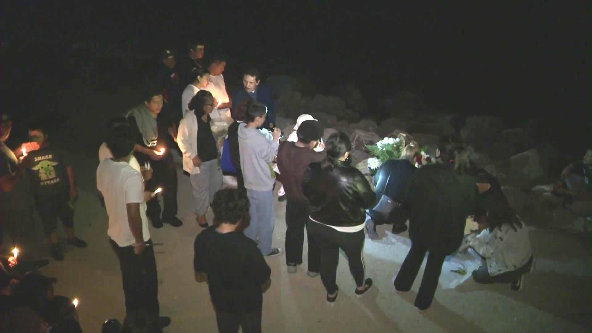 Loved ones gathered for a vigil to honor Emmanuel Baltazar Silva at Las Tunas Beach on August 31, 2023. (KTLA)