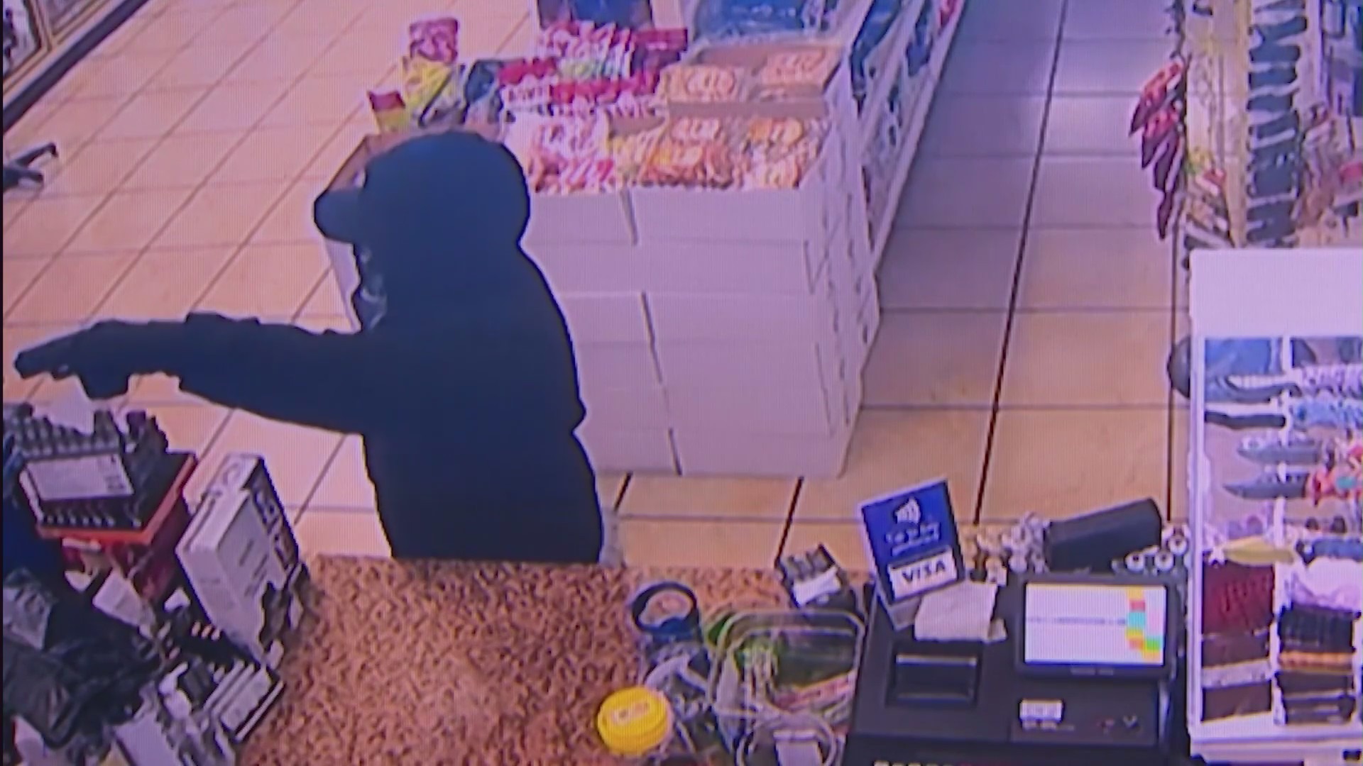 Security cameras captured the moment a store clerk thwarted an attempted armed robbery in Fountain Valley on August 16, 2023. (Cousins Liquor & Deli)