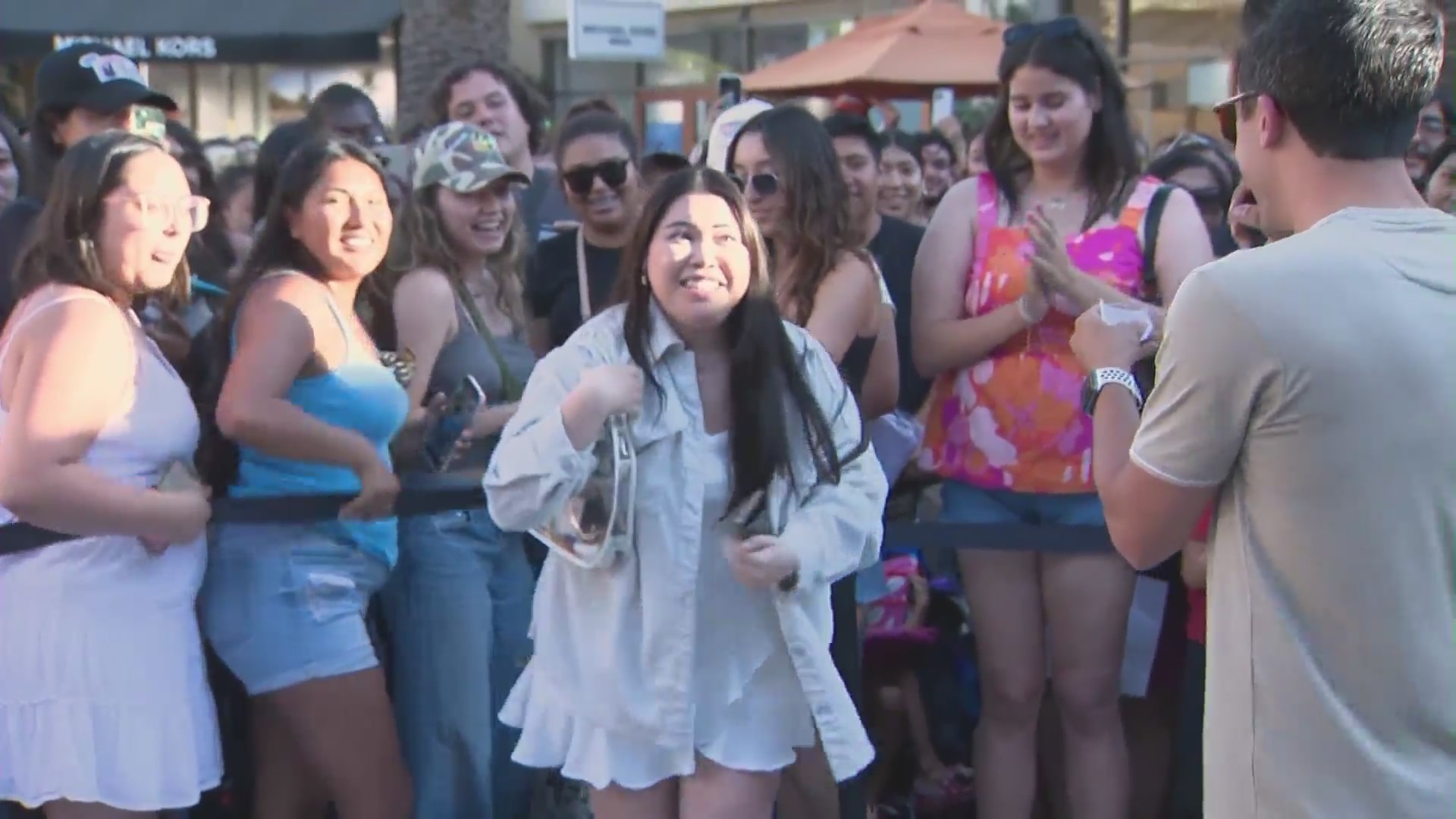 Frances Suavillo, the lucky winner of two floor tickets to Taylor Swift’s “The Eras Tour” at Sofi Stadium pictured at The Citadel Outlets on August 1, 2023. (KTLA)