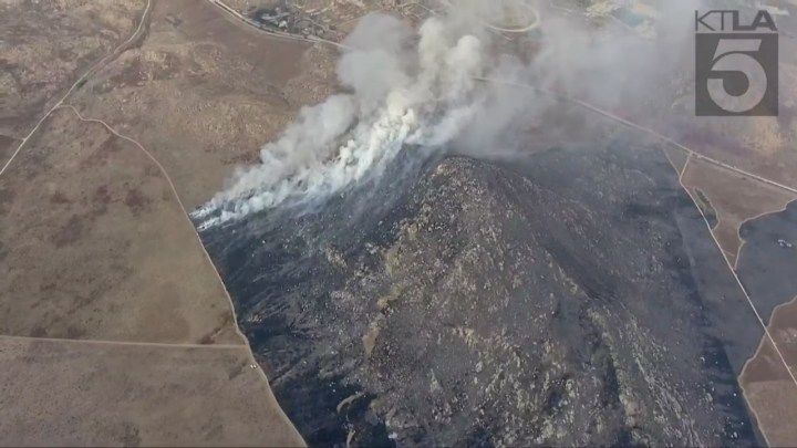 Fire crews battling the massive Rock Fire in Perris on August 9, 2023. (KTLA)