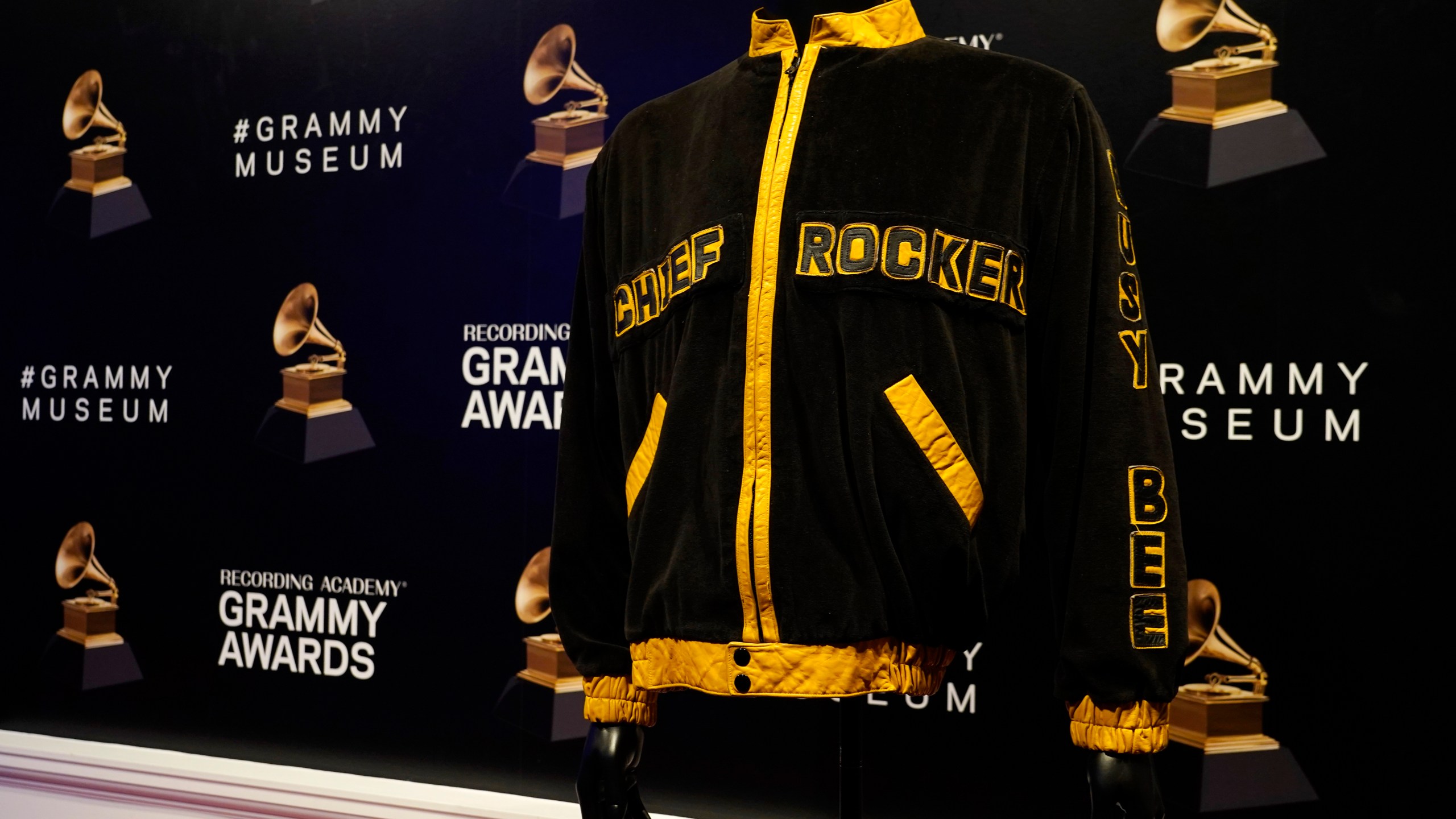 A jacket that was worn by hip hop musician Chief Rocker Busy Bee is displayed in preparation for the exhibit "Hip-Hop America: The Mixtape," at the Grammy Museum, Friday, Sept. 1, 2023, in Los Angeles. The Grammy Museum announced on Wednesday that it is launching the exhibit, celebrating 50 years of the genre. It will open on October 7 and run until September 4, 2024. (AP Photo/Chris Pizzello)