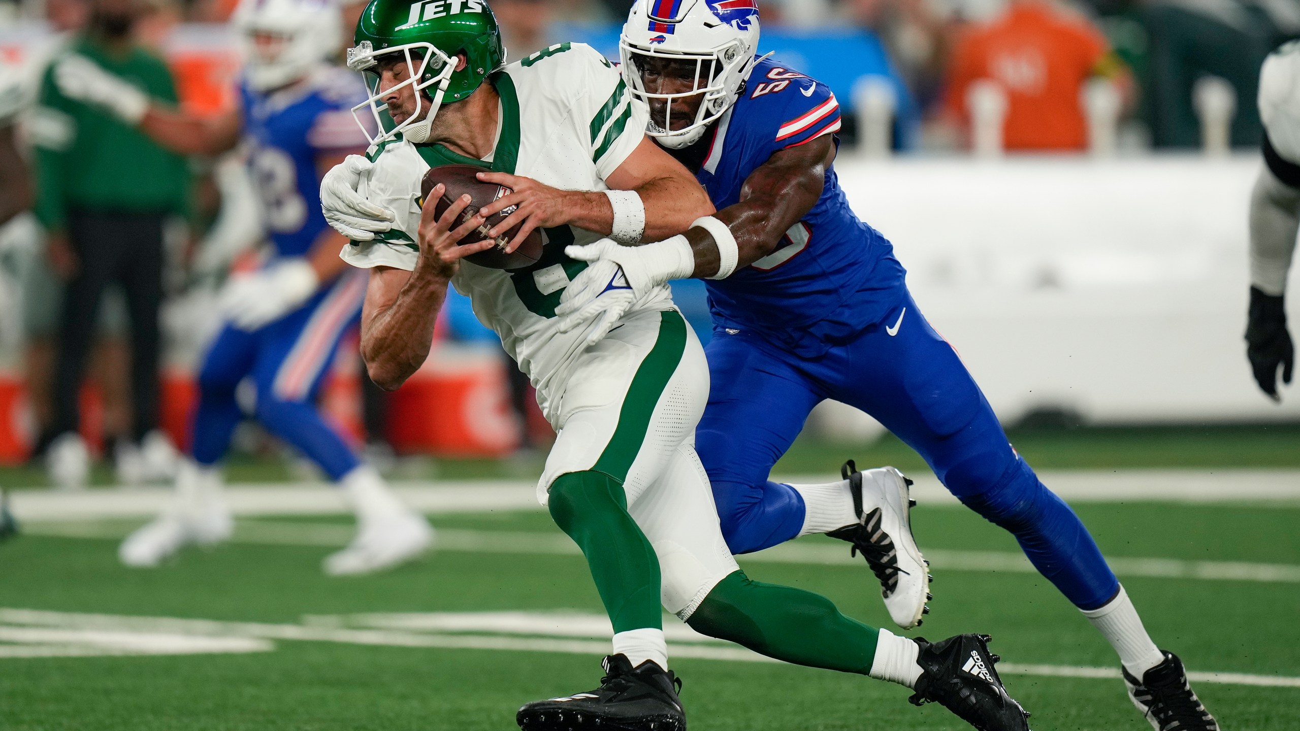 New York Jets quarterback Aaron Rodgers (8) is sacked by Buffalo Bills defensive end Leonard Floyd (56) during the first quarter of an NFL football game, Monday, Sept. 11, 2023, in East Rutherford, N.J. (AP Photo/Seth Wenig)