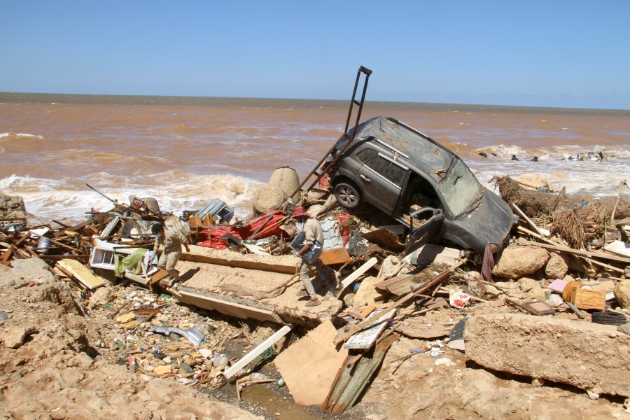 Damage from massive flooding is seen in Derna, Libya, Wednesday, Sept.13, 2023. Search teams are combing streets, wrecked buildings, and even the sea to look for bodies in Derna, where the collapse of two dams unleashed a massive flash flood that killed thousands of people. (AP Photo/Yousef Murad)