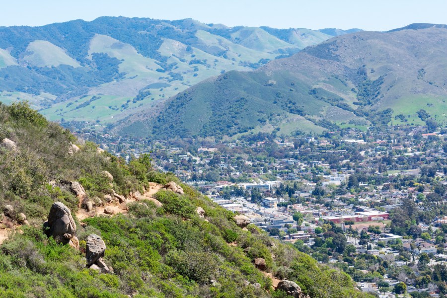 Aerial view of Bishop Peak trail surrounded by chaparral on the hill with San Luis Obispo in the background. (Getty Images)