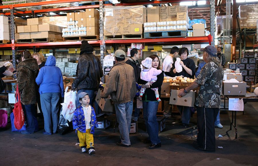 People line up to receive food for a Thanksgiving meal November 24, 2009 at the Alameda Food Bank in Alameda, California. (Getty Images)