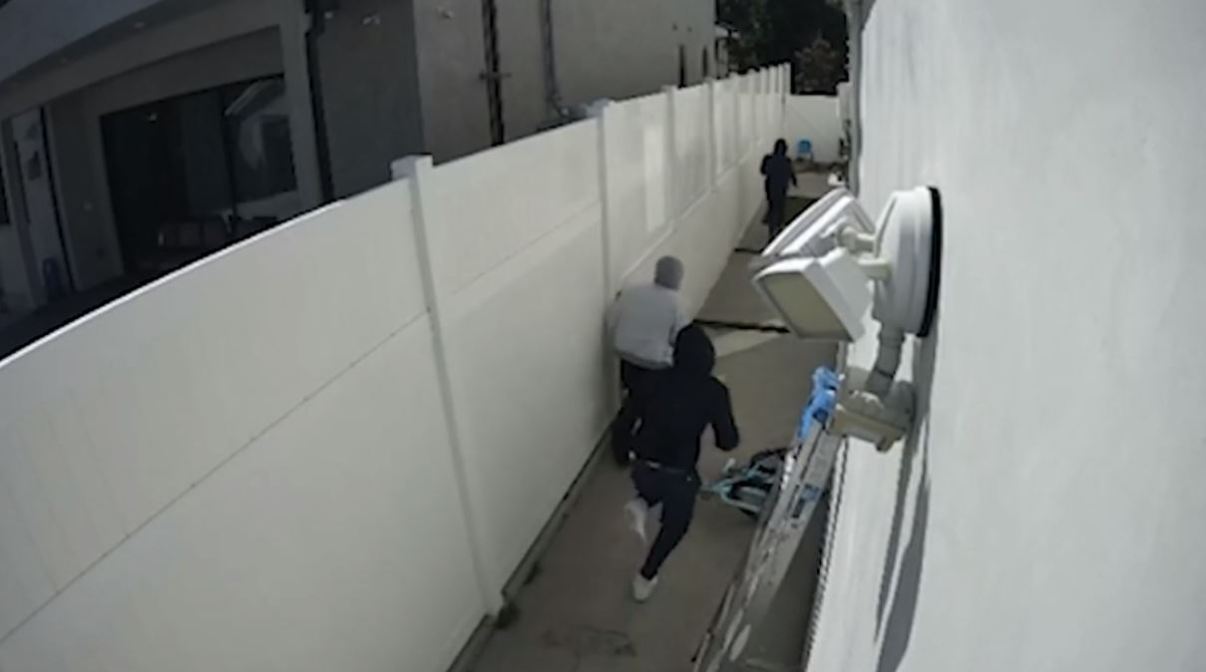 Security video captured the moment three masked thieves attempted to break into a Pico-Robertson home in broad daylight.