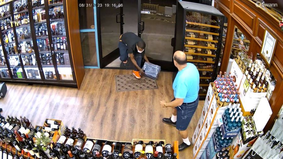 Security video captured a thief escaping with a $1,000 bottle of liquor during a violent confrontation at a liquor store in Calabasas on Aug. 31, 2023. (Malibu Liquor and Wine)