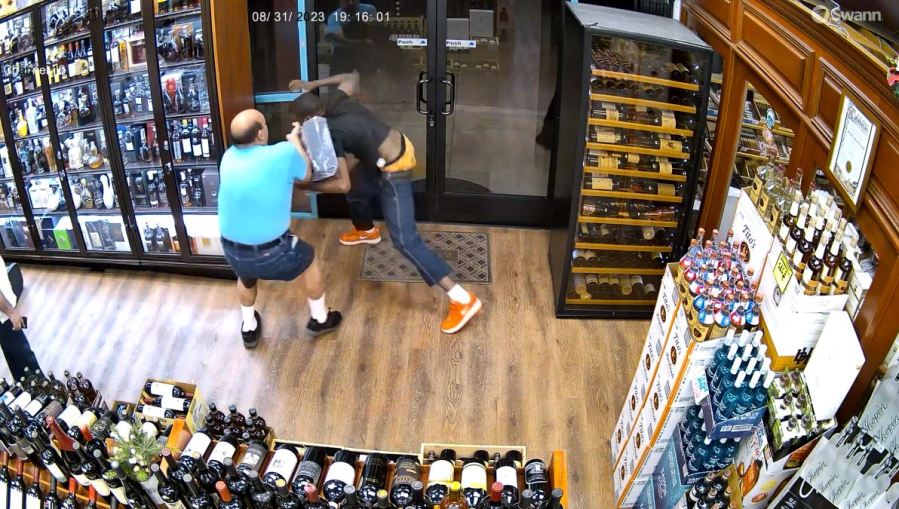 Security video captured a thief escaping with a $1,000 bottle of liquor during a violent confrontation at a liquor store in Calabasas on Aug. 31, 2023. (Malibu Liquor and Wine)