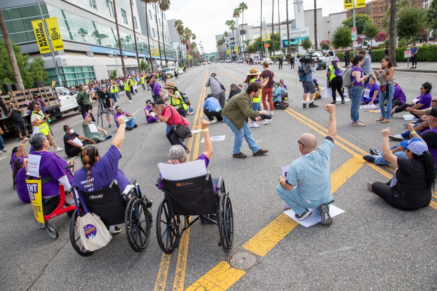 Health care workers sit in protest on a roadway in Hollywood as part of an organized demonstration against Kaiser Permanente on Sept. 4, 2023. In total, 23 were arrested and cited. (SEIU UHW)