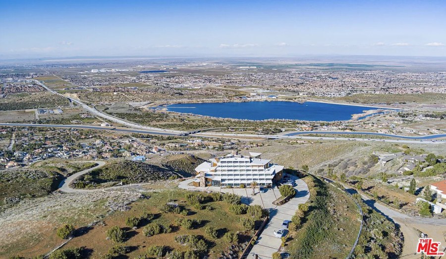 Nestled atop a hill at the end of a private road, the home offers panoramic views of the region. (AVOH)