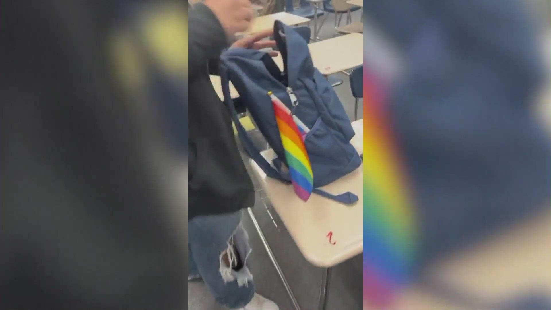 Pride flags being handed out by Moxxie, a 16-year-old high school student in Temecula, to his classmates in protest of the school district’s flag ban policy. (Moxxie)