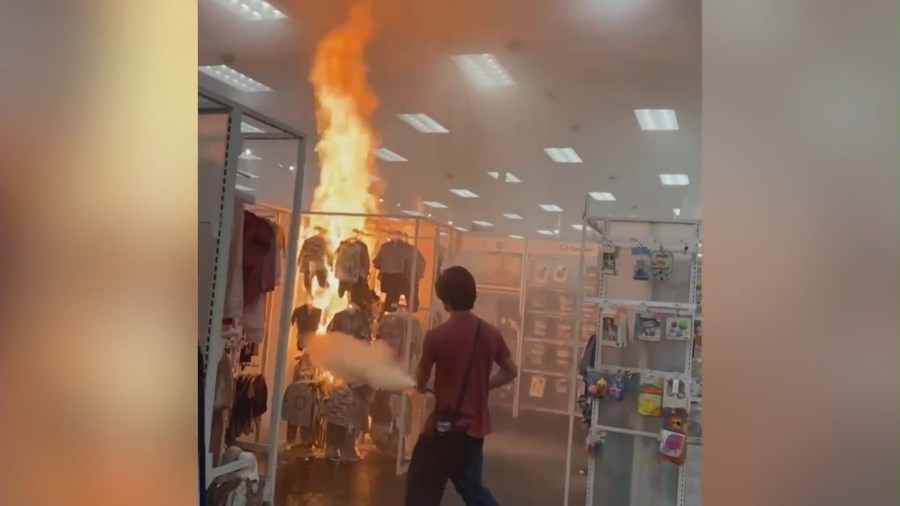 Video captured an employee extinguishing a large fire that broke out at a Target in Buena Park on Sept. 5, 2023. (OnScene.TV)