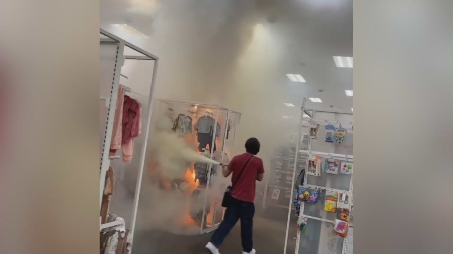 Video captured an employee extinguishing a large fire that broke out at a Target in Buena Park on Sept. 5, 2023. (OnScene.TV)