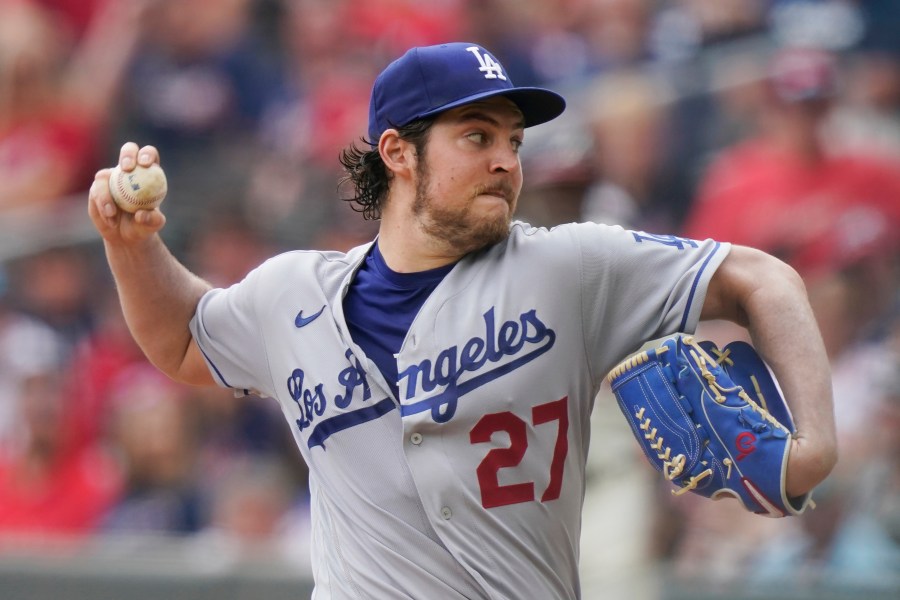 FILE - Los Angeles Dodgers starting pitcher Trevor Bauer (27) delivers in the first inning of a baseball game against the Atlanta Braves Sunday, June 6, 2021, in Atlanta. Former major league pitcher Trevor Bauer and a woman who accused him of beating and sexually assaulting her in 2021 have settled their legal dispute, Bauer's attorneys said Monday, Oct. 2, 2023. (AP Photo/Brynn Anderson, File)