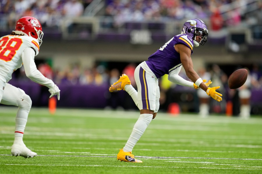 Minnesota Vikings wide receiver Justin Jefferson looks to catch a pass in front of Kansas City Chiefs cornerback L'Jarius Sneed, left, during the first half of an NFL football game, Sunday, Oct. 8, 2023, in Minneapolis. The pass was incomplete. (AP Photo/Abbie Parr)