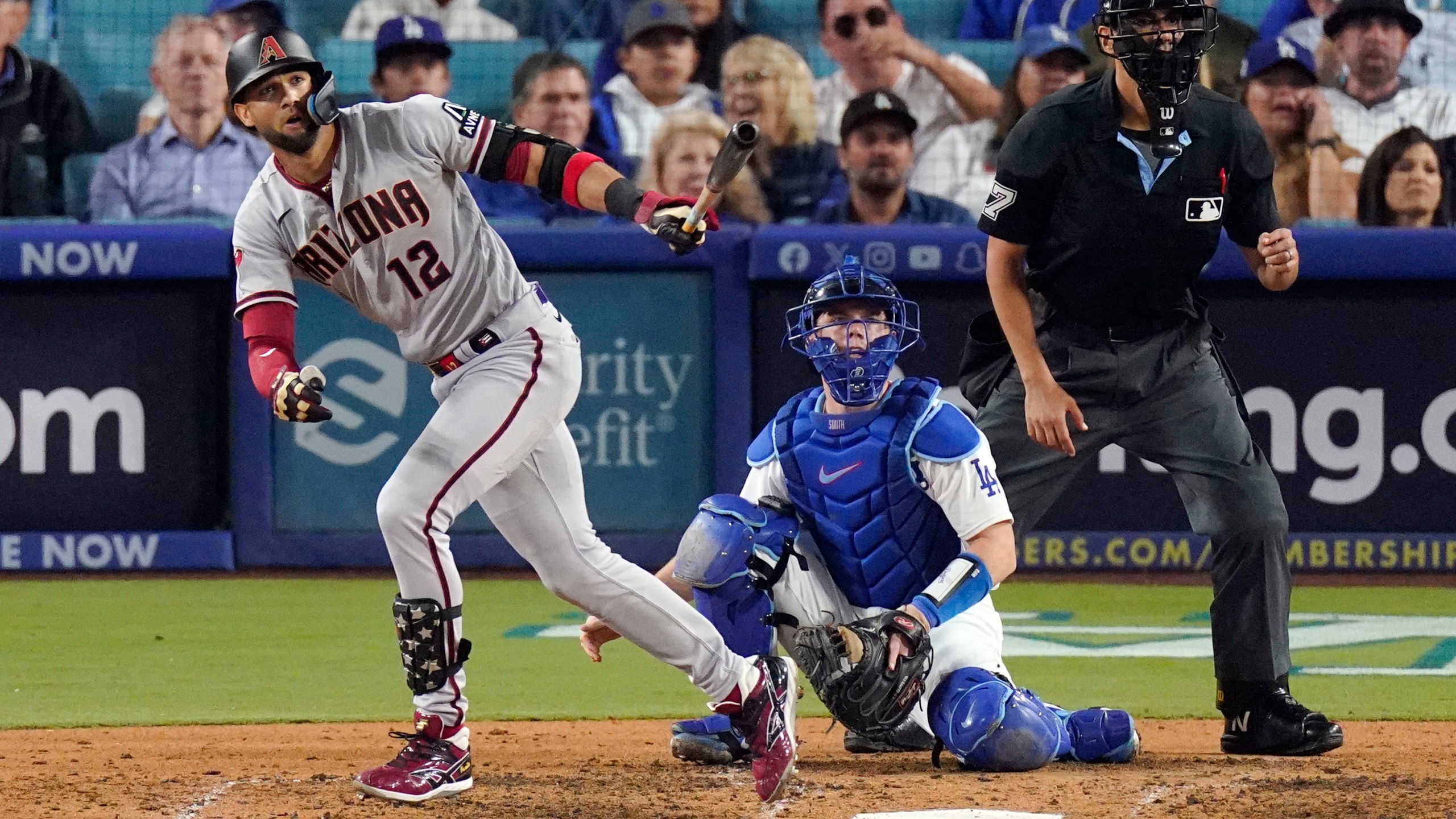 Arizona Diamondbacks' Lourdes Gurriel Jr. watches his solo home run during the sixth inning in Game 2 of a baseball NL Division Series against the Los Angeles Dodgers, Monday, Oct. 9, 2023, in Los Angeles. (AP Photo/Mark J. Terrill)