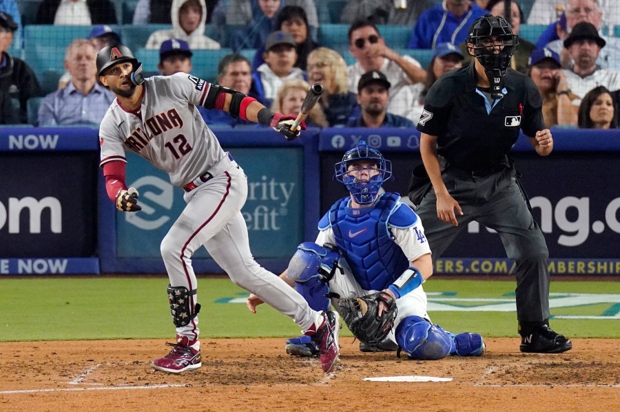 Arizona Diamondbacks' Lourdes Gurriel Jr. watches his solo home run during the sixth inning in Game 2 of a baseball NL Division Series against the Los Angeles Dodgers, Monday, Oct. 9, 2023, in Los Angeles. (AP Photo/Mark J. Terrill)